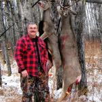 Bob Valcov with two Alberta whitetails.