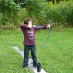 Allen's grandson trying archery.